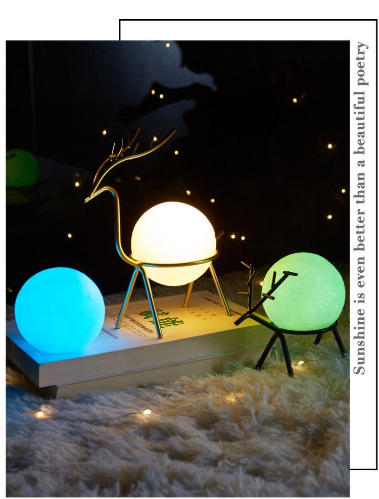 Decorative deer night light with glowing color-changing spheres