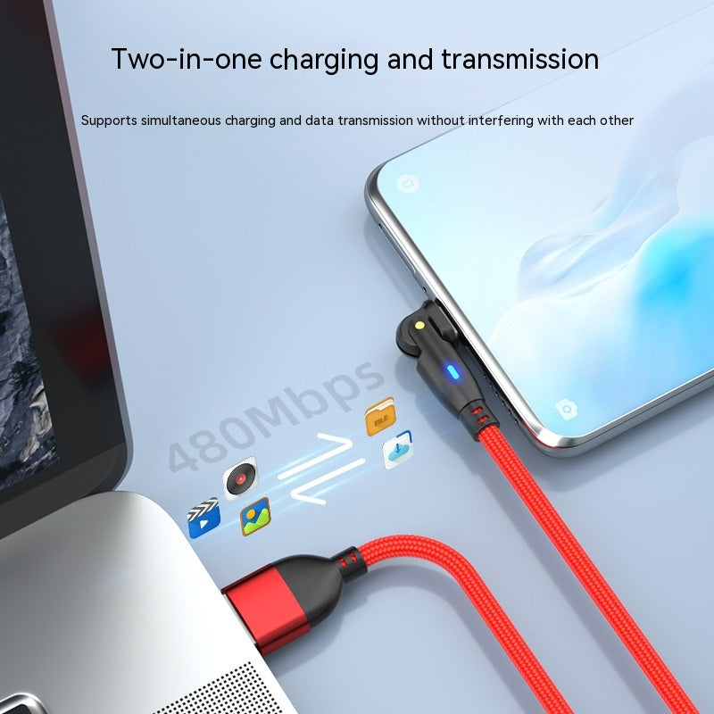 Two-in-one charging and transmission cable with smartphone and laptop on a light gray background